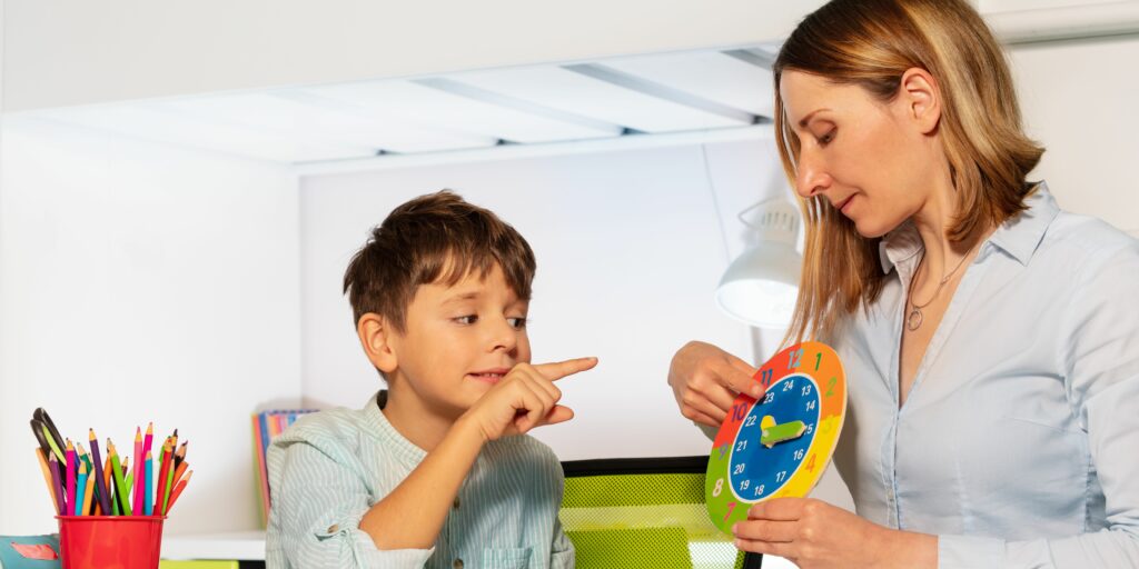 A therapist working on an autism child using speech therapy techniques for child development
