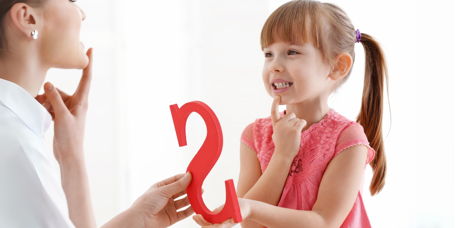 A speech therapist working with a child, engaging activities during a speech therapy session."