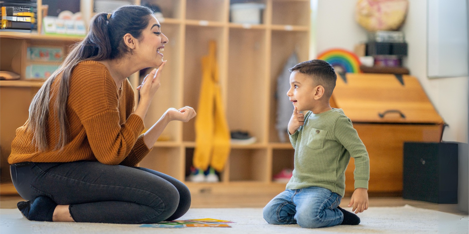 During a speech therapy session, a child is actively participating in engaging activities under the guidance of a speech therapist.