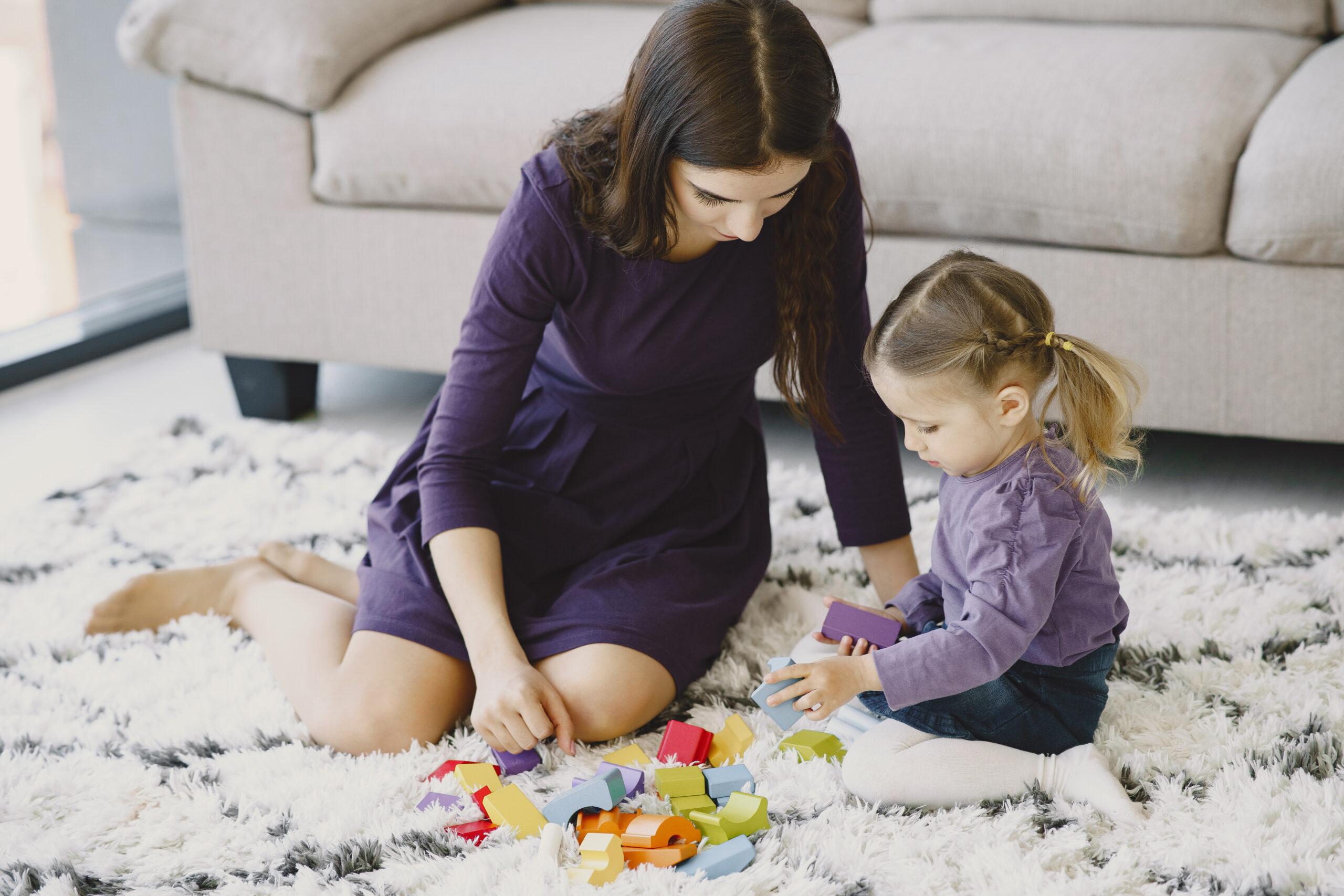 This is an image of a stressed mother of an daughter suffering from ADHD during child development.